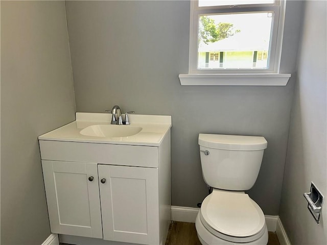 bathroom featuring toilet and vanity