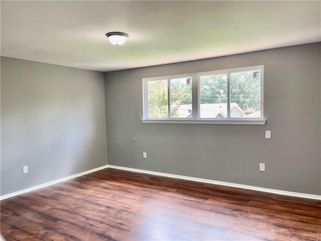 unfurnished room featuring hardwood / wood-style flooring