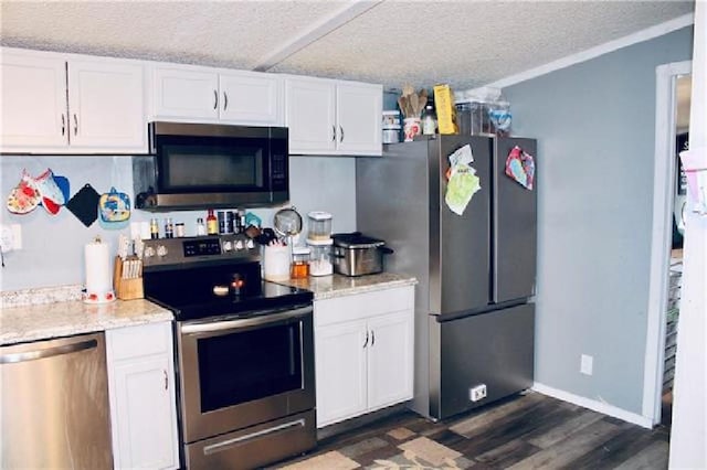 kitchen featuring white cabinets, stainless steel appliances, dark hardwood / wood-style floors, and a textured ceiling