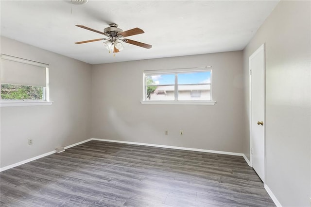 spare room featuring wood-type flooring and ceiling fan