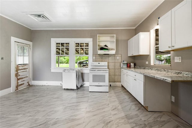 kitchen with white cabinets, a wealth of natural light, light tile flooring, and electric stove