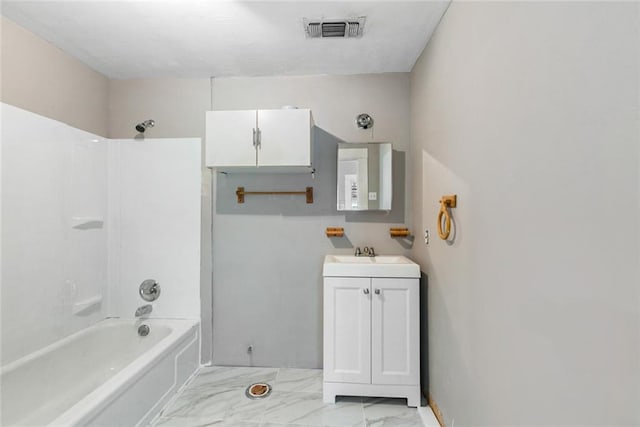 bathroom featuring  shower combination, tile floors, and vanity