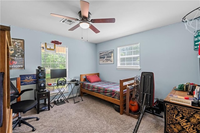 carpeted bedroom featuring ceiling fan