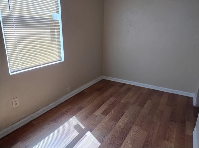 unfurnished room featuring wood-type flooring