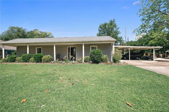 ranch-style house featuring a carport and a front lawn