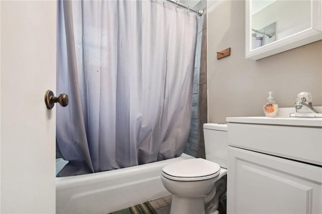 full bathroom with vanity, shower / bath combo, and toilet