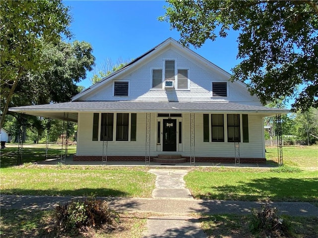 farmhouse with a front lawn and covered porch