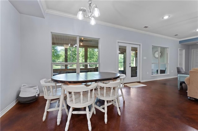 dining room with a chandelier and ornamental molding