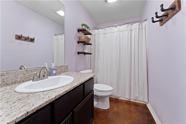 bathroom featuring oversized vanity and toilet