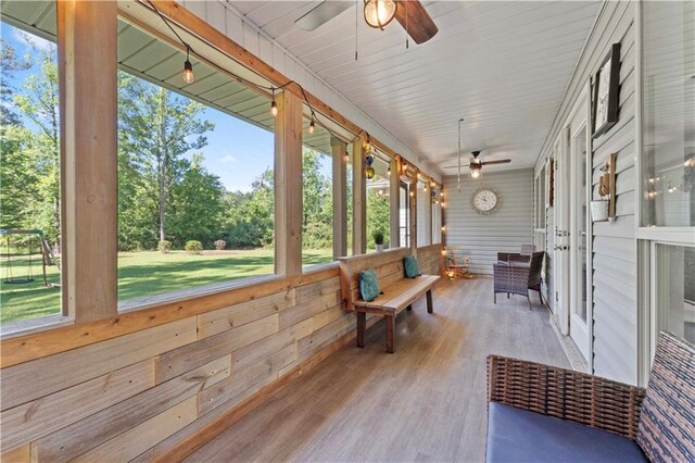 sunroom / solarium with ceiling fan