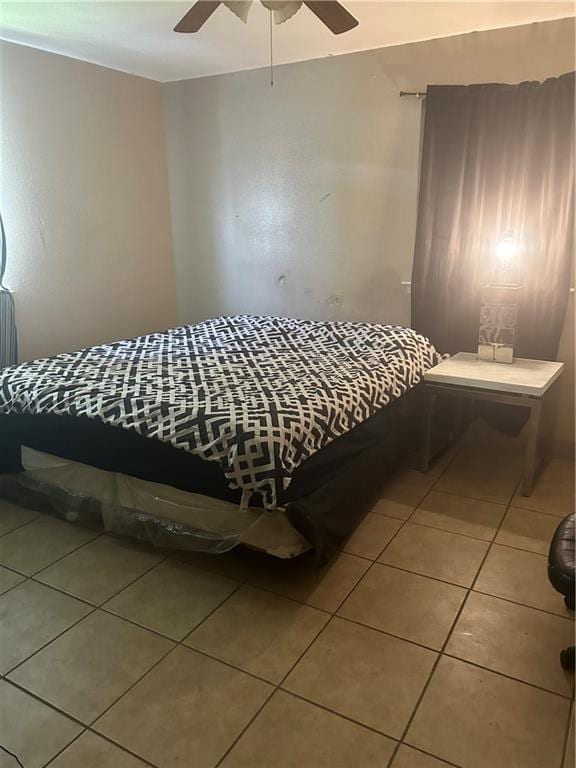 bedroom with tile flooring and ceiling fan