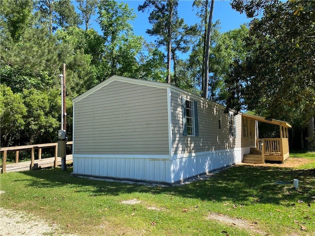 view of home's exterior with a yard