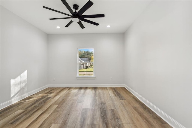 unfurnished room featuring ceiling fan and light wood-type flooring