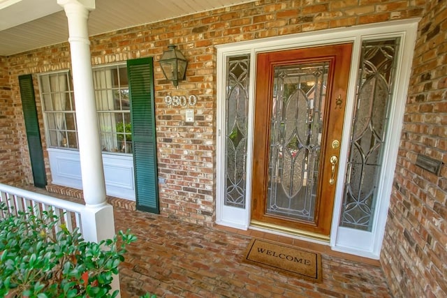 property entrance featuring a porch