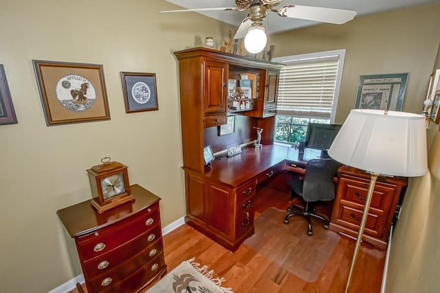 office space with ceiling fan and light hardwood / wood-style flooring