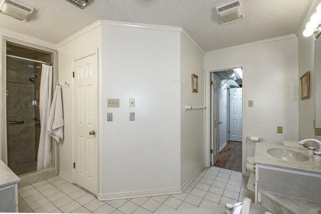 bathroom with crown molding, vanity, tile flooring, toilet, and a textured ceiling