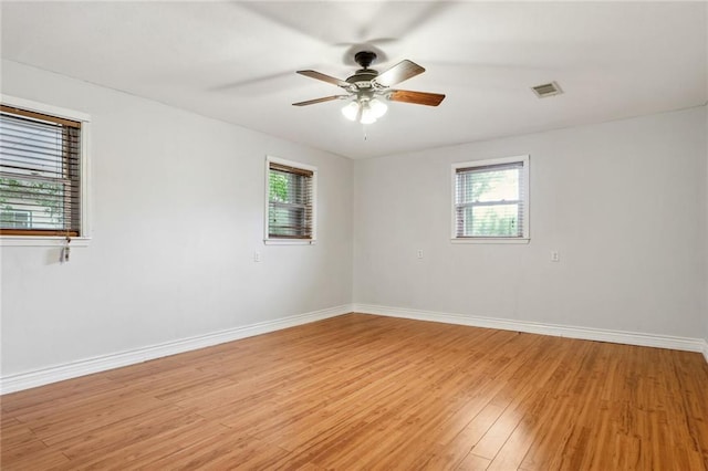 unfurnished room featuring light hardwood / wood-style flooring and ceiling fan