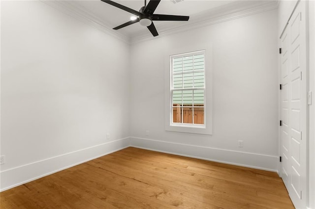 spare room with crown molding, ceiling fan, and hardwood / wood-style floors