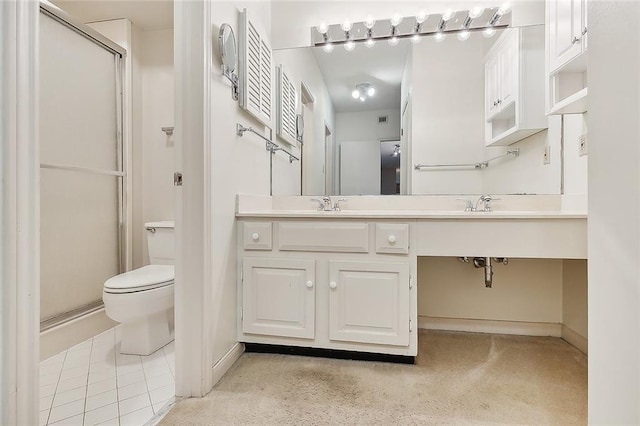 bathroom featuring a shower with door, dual bowl vanity, toilet, and tile floors