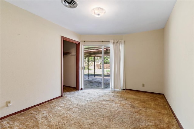 unfurnished room featuring carpet flooring