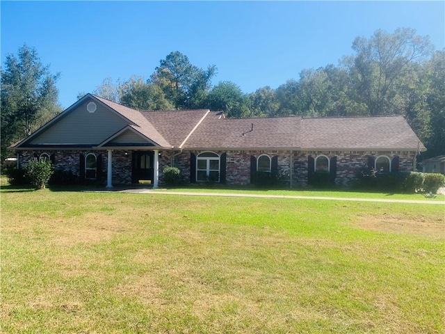 ranch-style home featuring a front yard