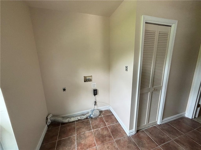 washroom with washer hookup, dark tile floors, and hookup for an electric dryer