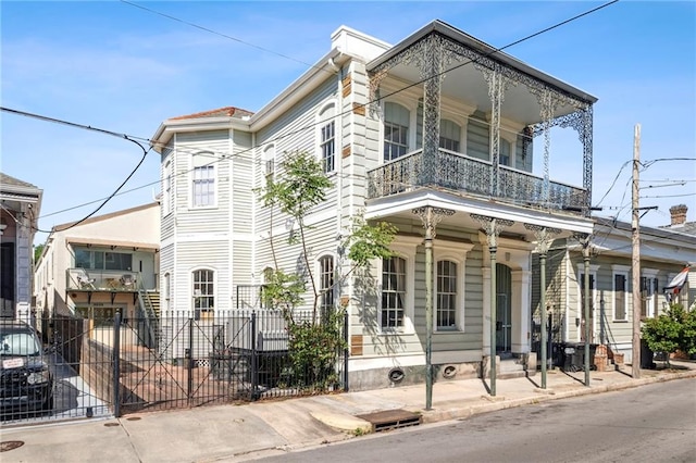 view of front of house with a balcony