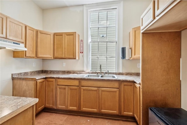 kitchen featuring sink and light tile floors