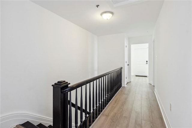 hall with light hardwood / wood-style floors