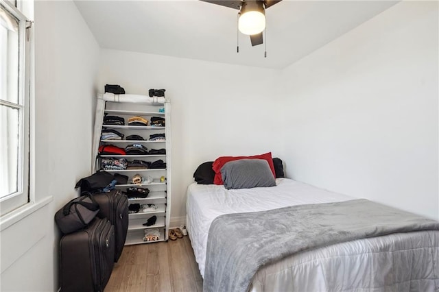 bedroom with ceiling fan and hardwood / wood-style floors