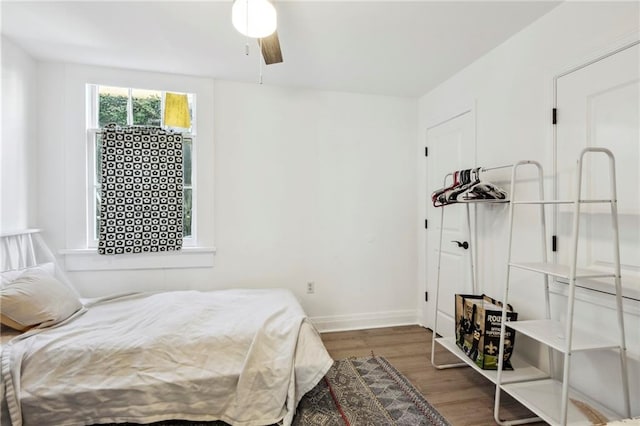 bedroom featuring wood-type flooring and ceiling fan