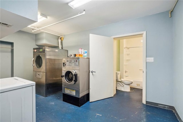 clothes washing area with sink and independent washer and dryer