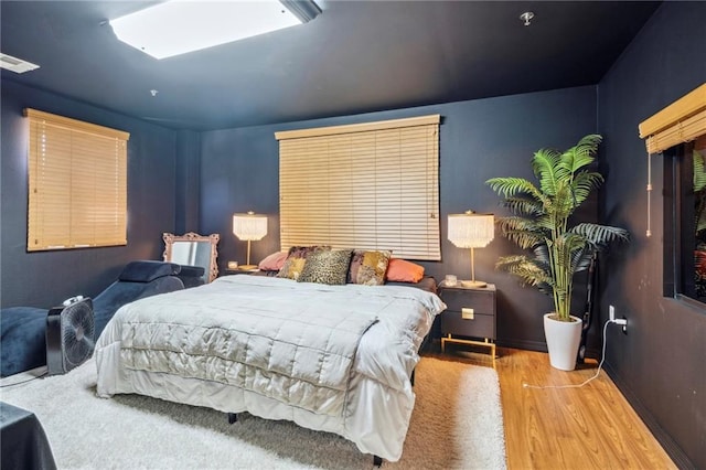 bedroom featuring wood-type flooring