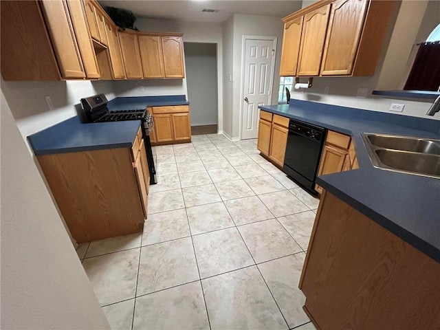 kitchen featuring sink, light tile flooring, range with gas stovetop, and dishwasher