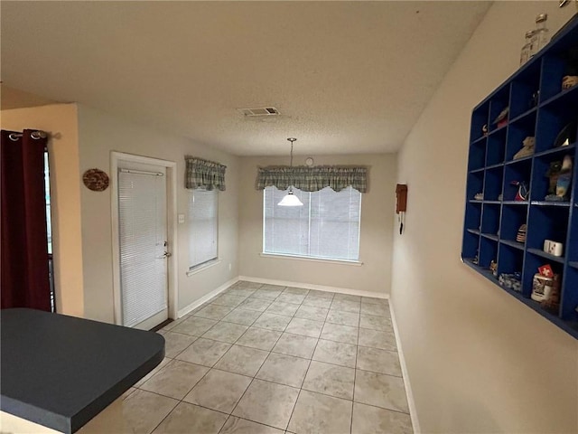 dining space featuring tile flooring