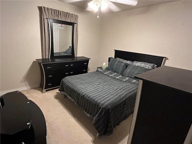 bedroom with light colored carpet and ceiling fan