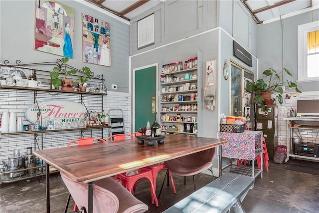 dining space with concrete floors