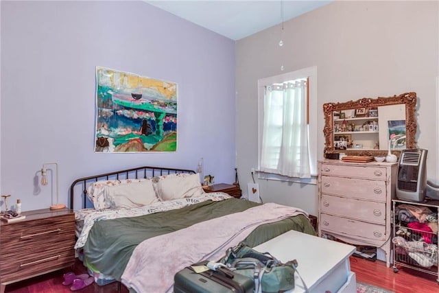 bedroom with hardwood / wood-style flooring