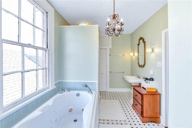 bathroom featuring a chandelier, tile flooring, and vanity