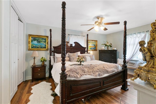 bedroom featuring a closet, dark wood-type flooring, and ceiling fan