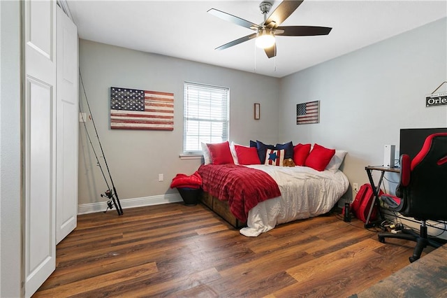 bedroom with ceiling fan and dark wood-type flooring