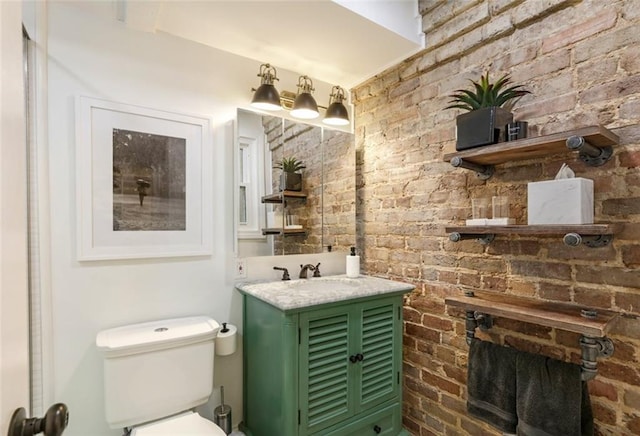 bathroom with toilet and vanity