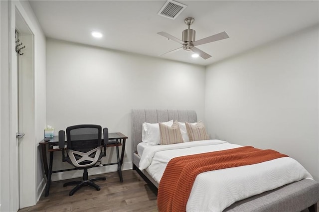 bedroom featuring wood-type flooring and ceiling fan