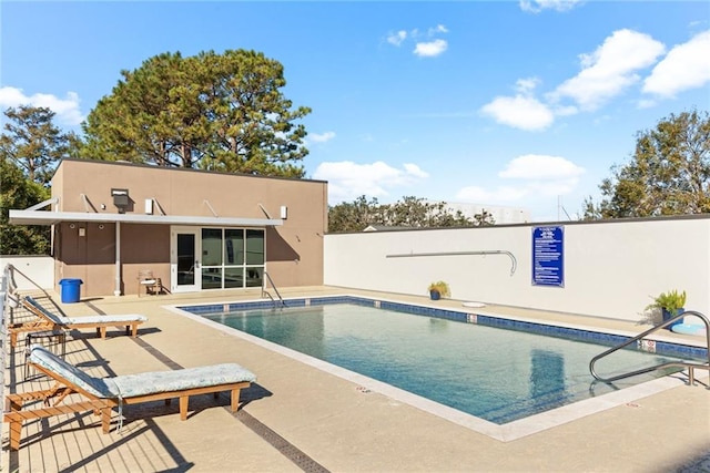 view of swimming pool with a patio area