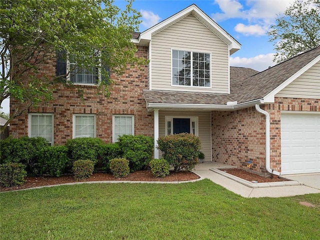 view of front facade with a garage and a front yard