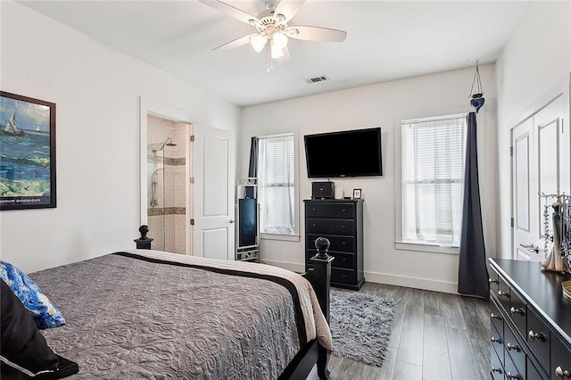 bedroom featuring ensuite bath, ceiling fan, and dark hardwood / wood-style floors