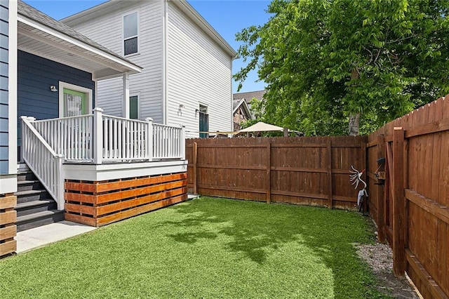 view of yard featuring a wooden deck