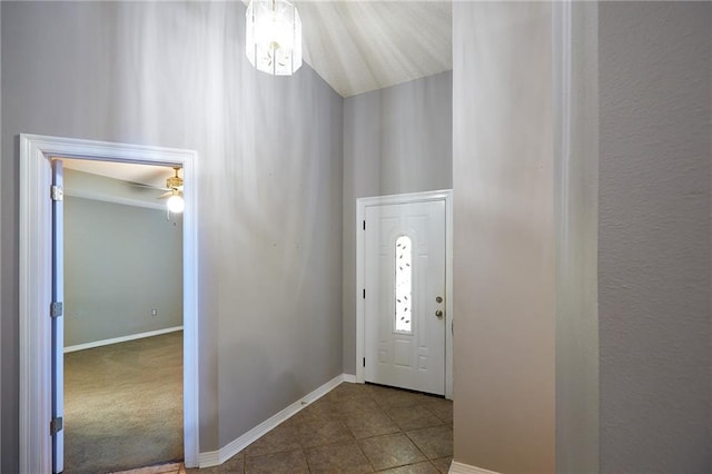 tiled entryway featuring ceiling fan