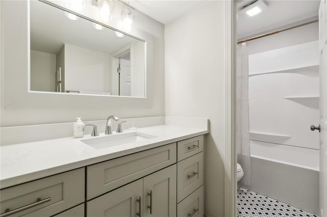 full bathroom featuring tile floors, vanity, toilet, and shower / bath combo with shower curtain