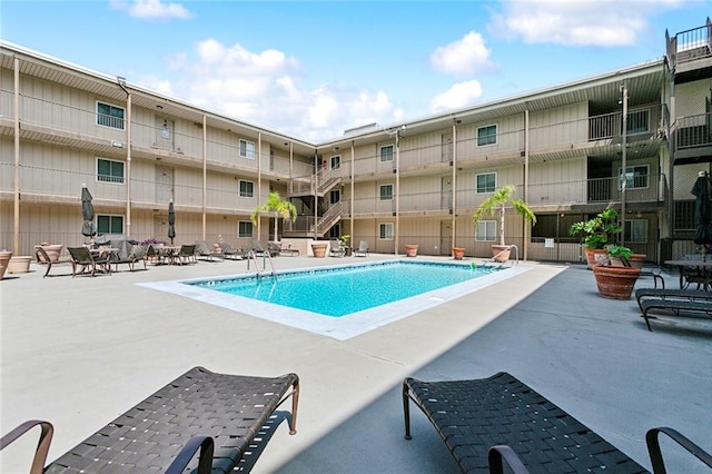 view of swimming pool featuring a patio area